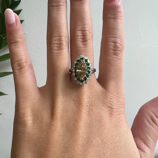 Post-1980s Platinum Fancy Brown Yellow Diamond & Emerald Ring worn on finger