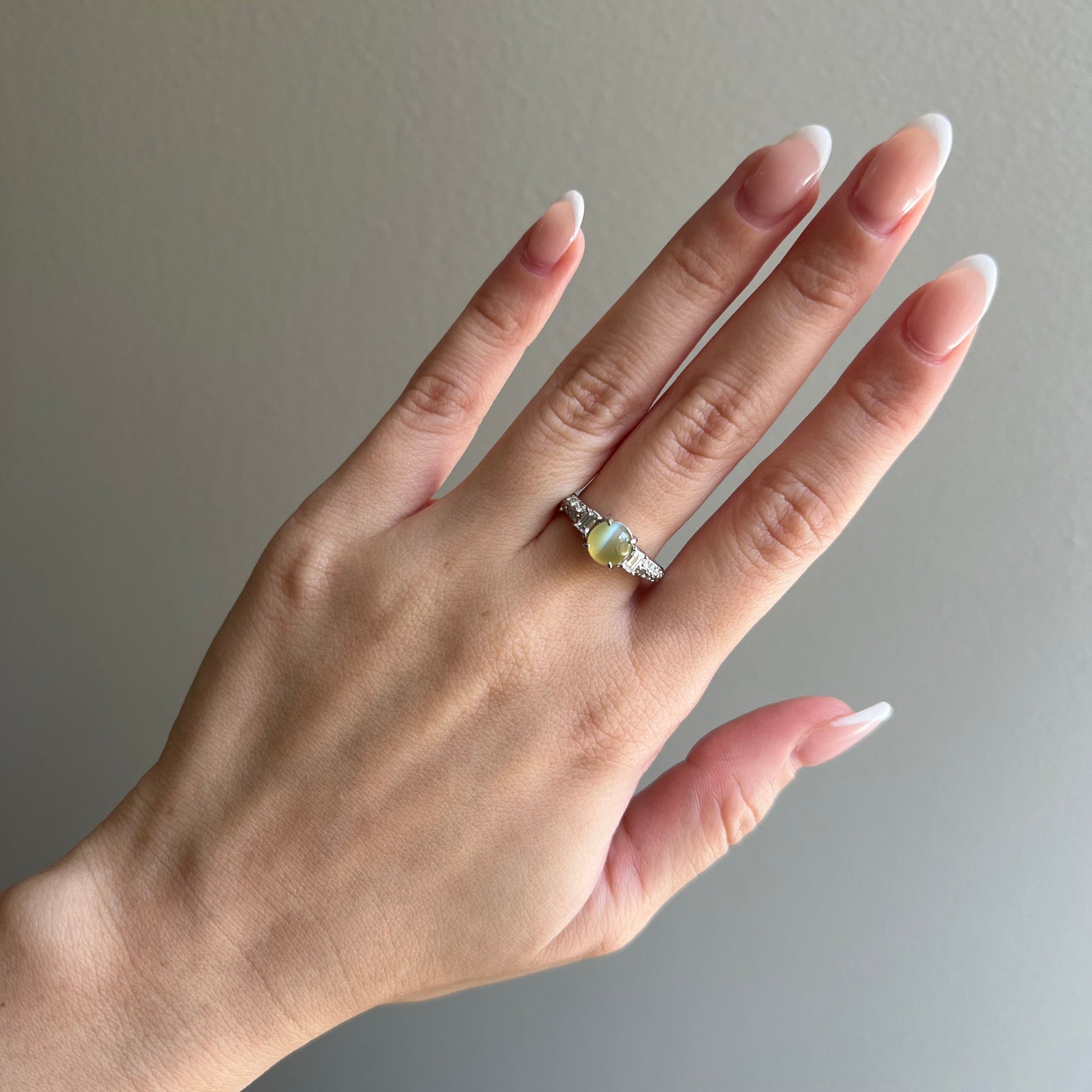 Post-1980s Platinum Chrysoberyl Cat's Eye & Diamond Ring on finger