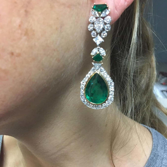 French 1980s Platinum & 18KT Yellow Gold Zambian Emerald & Diamond Earrings on ear
