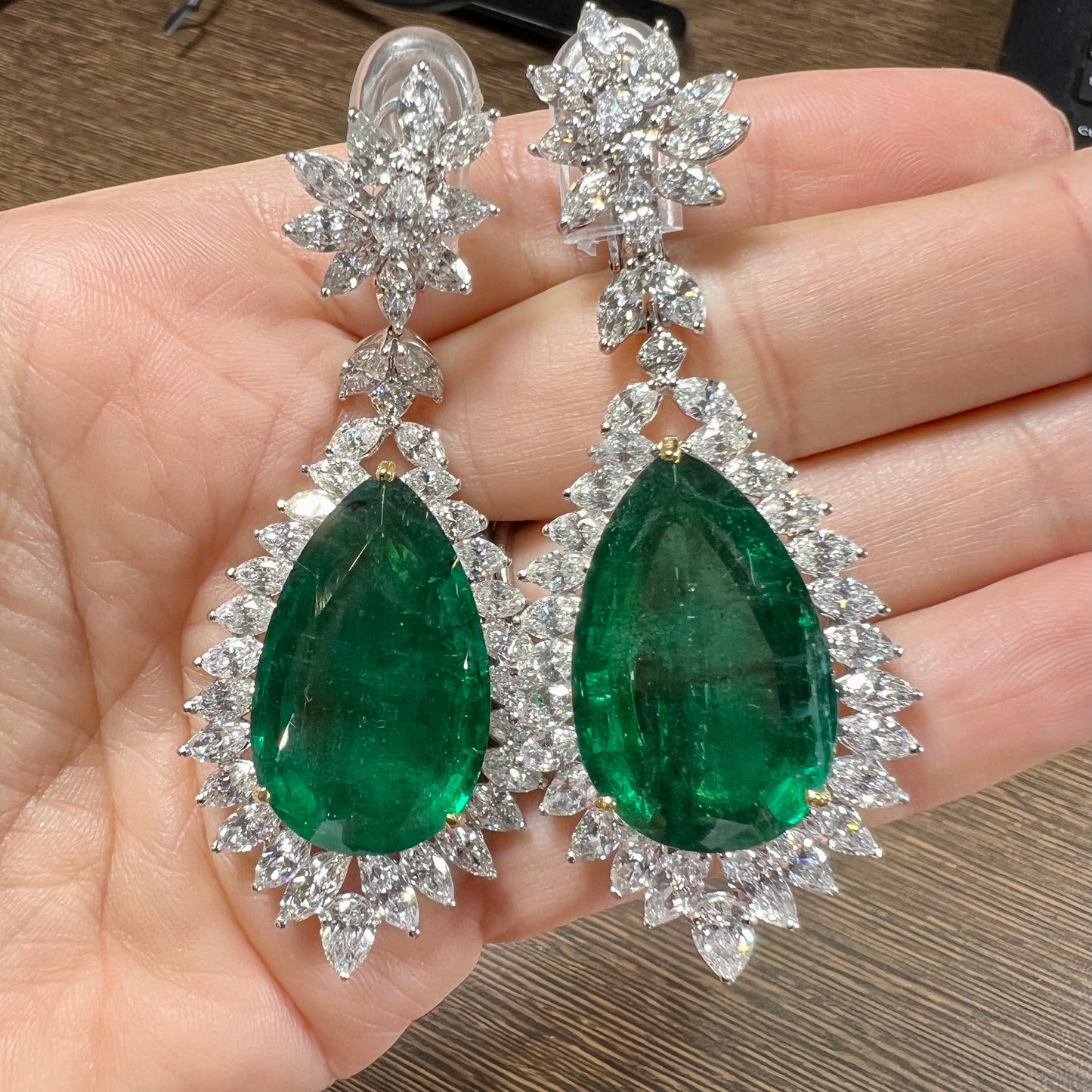 Post-1980s Platinum & 18KT White Gold Emerald & Diamond Earrings in hand