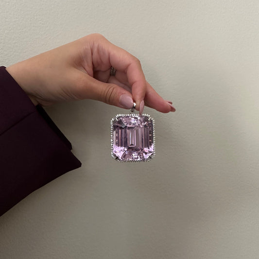 1980s 18KT White Gold Kunzite & Diamond Pendant in hand