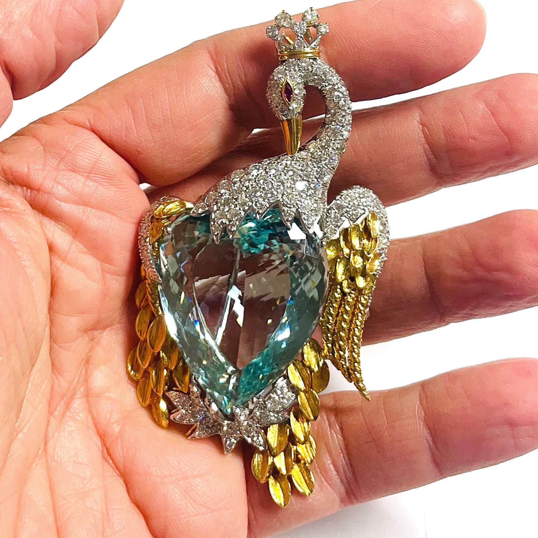 David Webb 1960s Platinum & 18KT Yellow Gold Aquamarine & Diamond Swan Brooch in hand