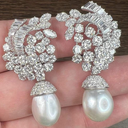 Bulgari 1960s Platinum Diamond & Natural Pearl Earrings in hand
