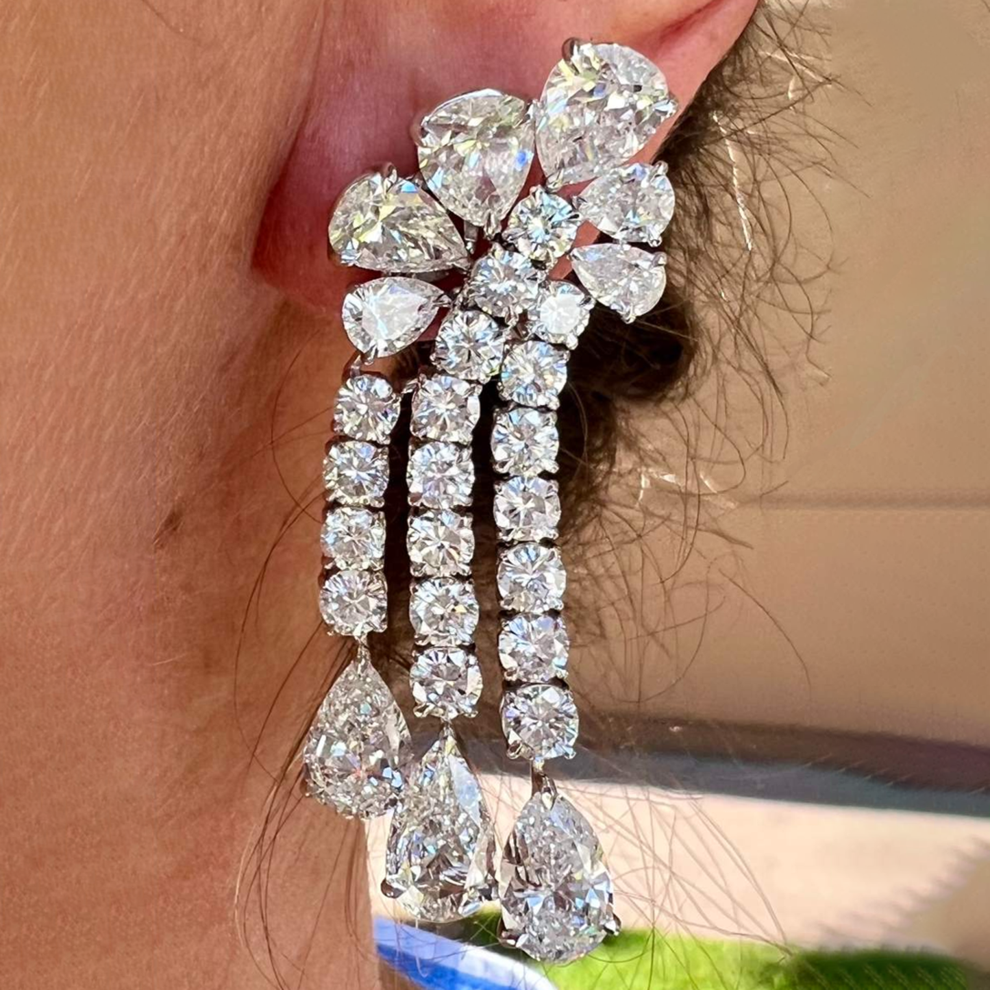 Post-1980s Platinum Diamond Earrings worn on ear