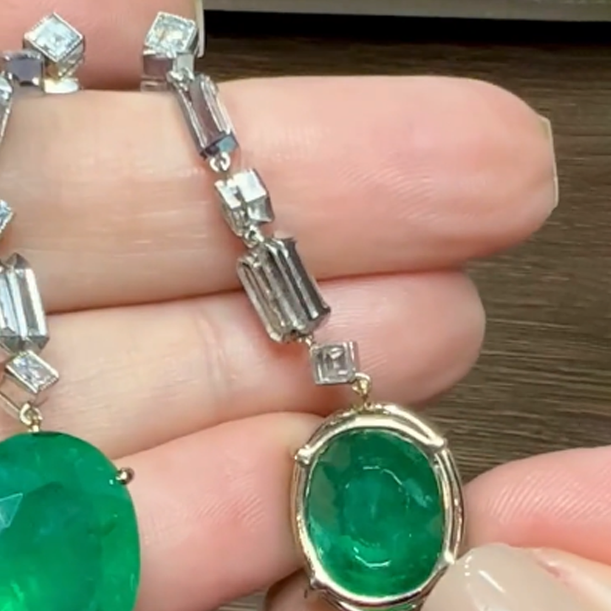 Post-1980s 18KT Yellow Gold & Platinum Emerald & Diamond Earrings back view in hand