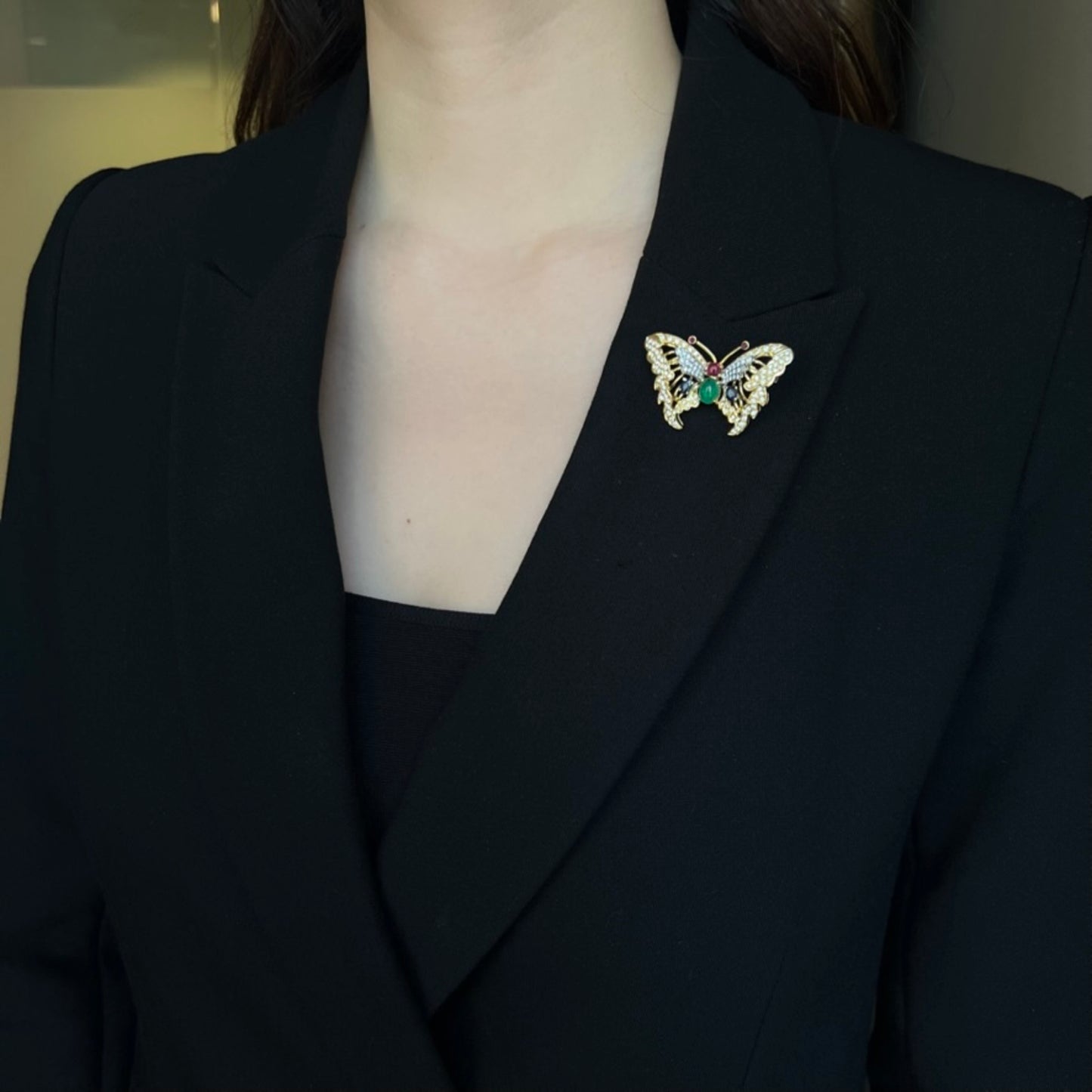 1970s 18KT Yellow Gold Diamond, Emerald, Ruby & Sapphire Butterfly Brooch on blouse