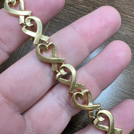 Tiffany & Co. Post-1980s 18KT Yellow Gold Paloma Picasso Bracelet in hand