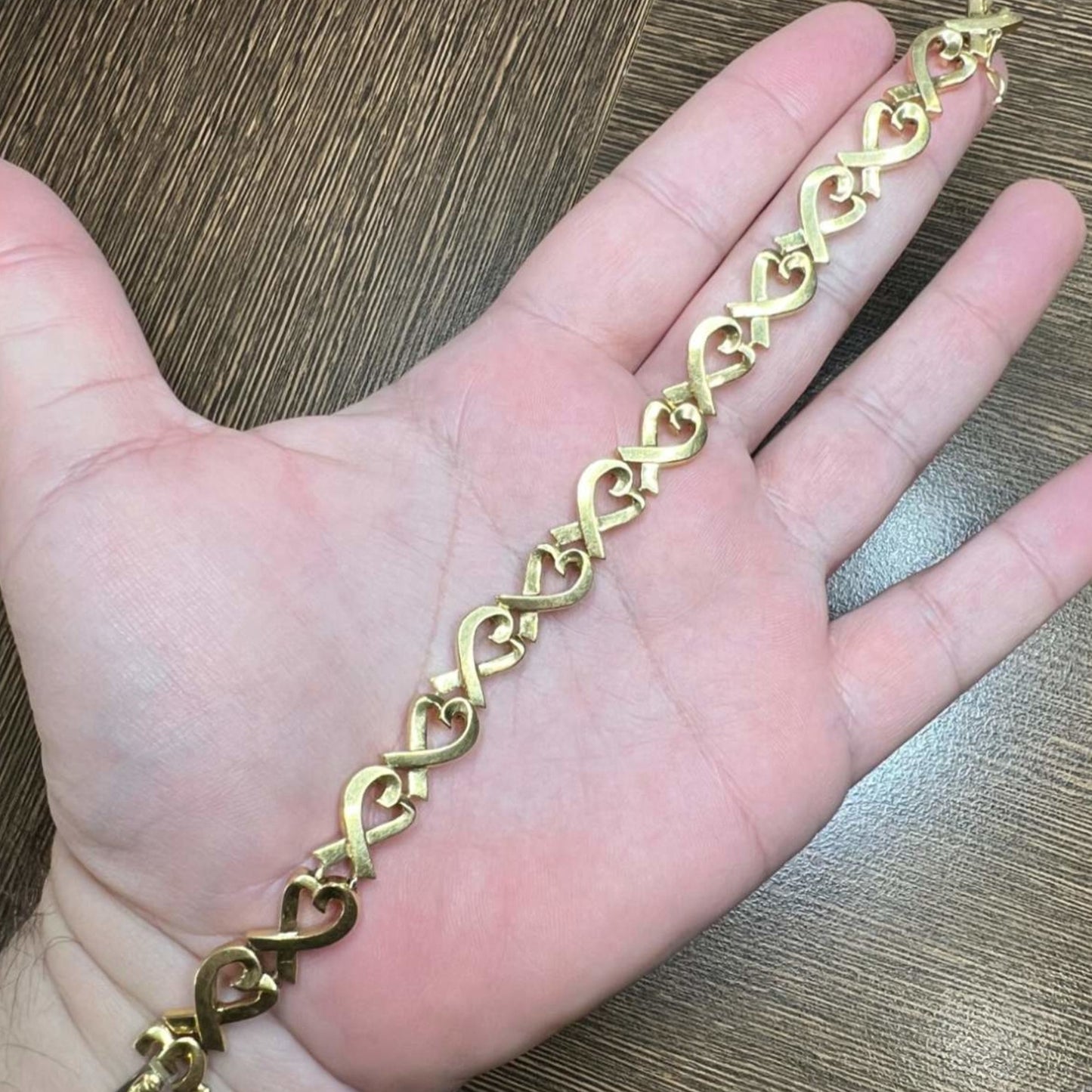 Tiffany & Co. Post-1980s 18KT Yellow Gold Paloma Picasso Bracelet in hand