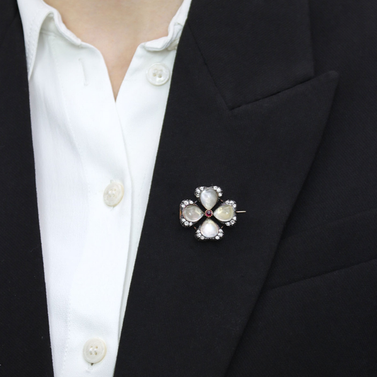 Carlo & Arthur Giuliano Antique 18KT Yellow Gold Moonstone, Diamond & Ruby Brooch on lapel