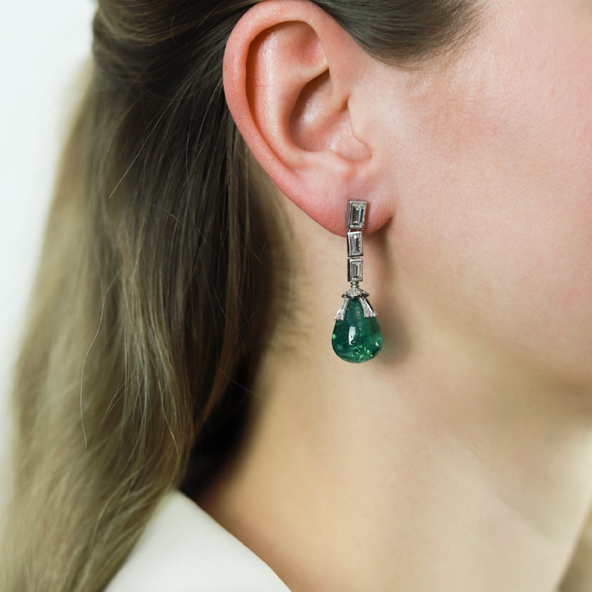 1970s Platinum Emerald & Diamond Earrings on ear