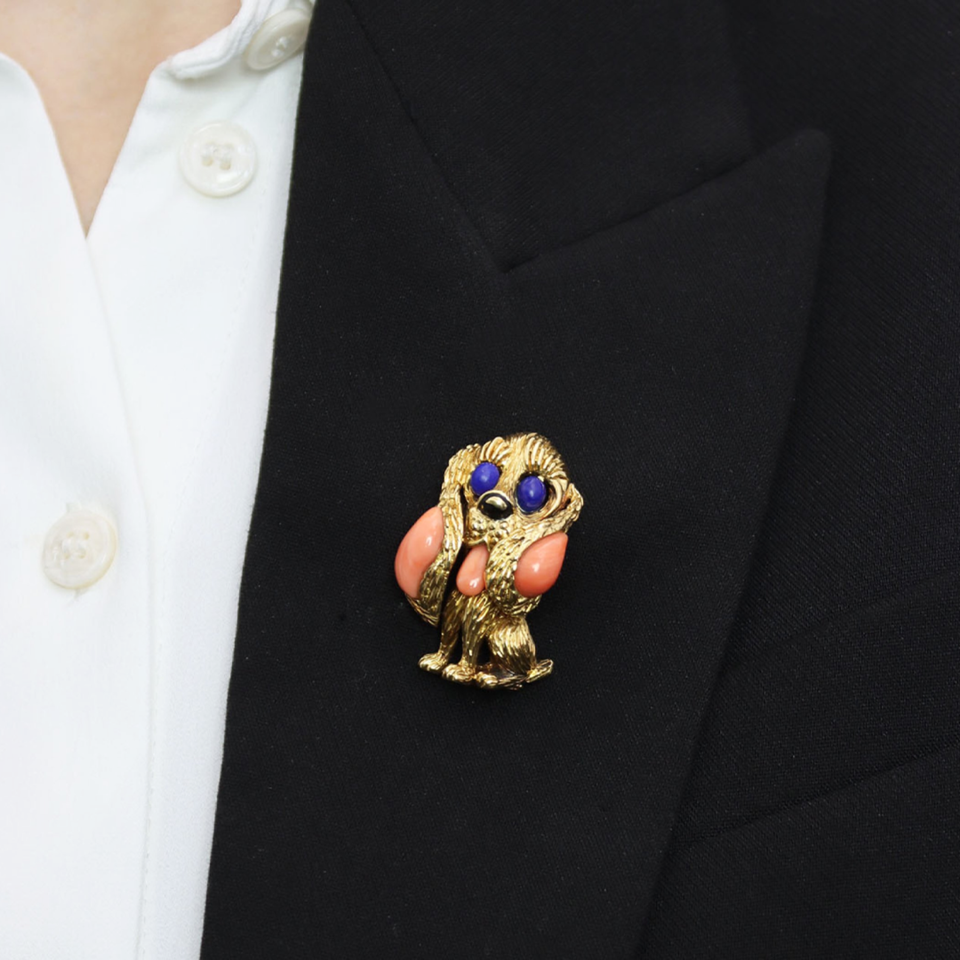 Mauboussin 1970s 18KT Yellow Gold Coral, Lapis Lazuli & Onyx Dog Brooch on lapel