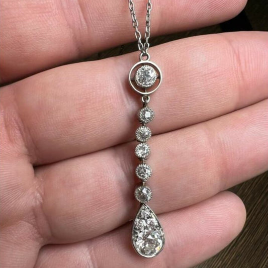 1930s Platinum Diamond Necklace in hand