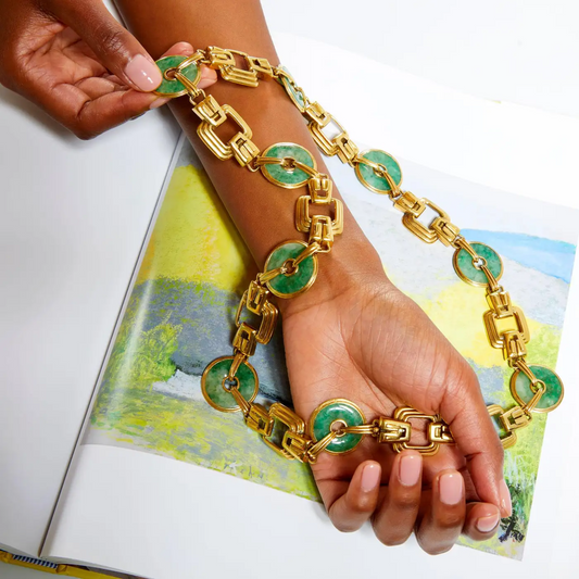 1980s 18KT Yellow Gold Jade Necklace in hand