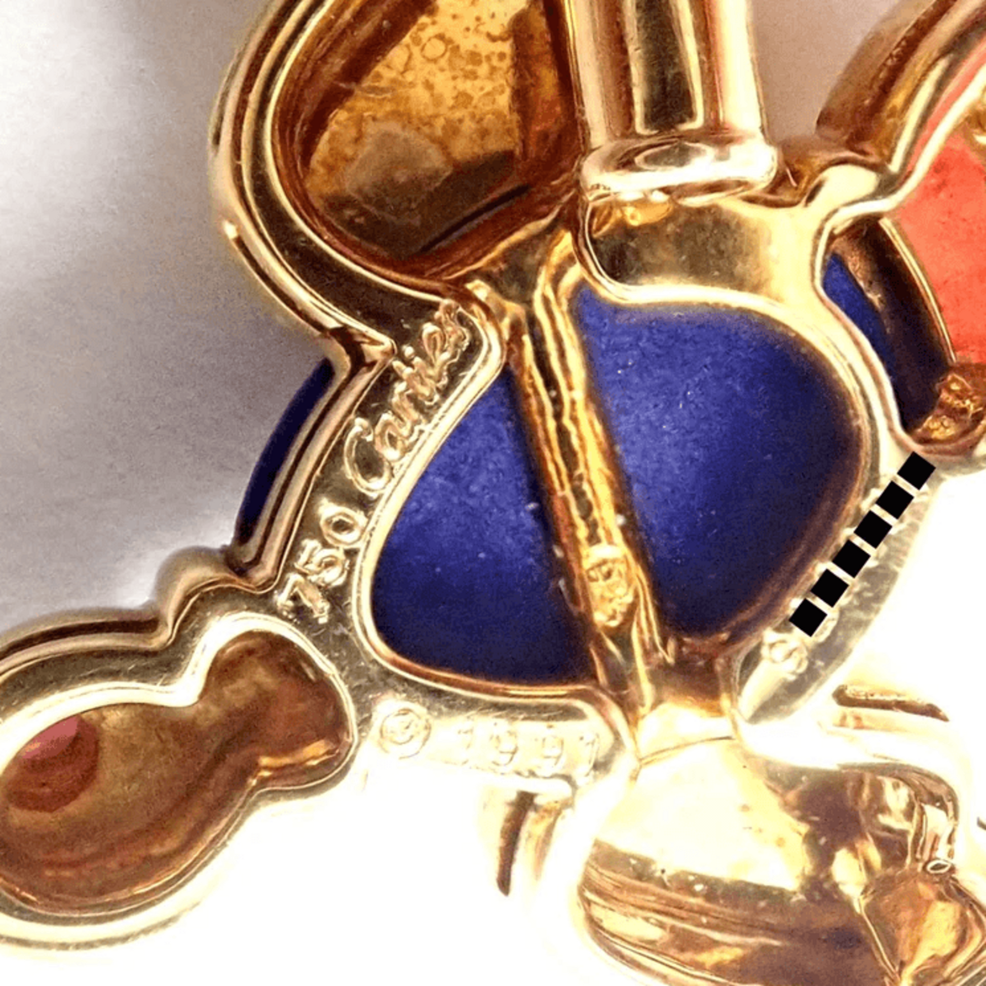 Cartier Post-1980s 18KT Yellow Gold Lapis Lazuli & Ruby Bird Brooch close-up of signature