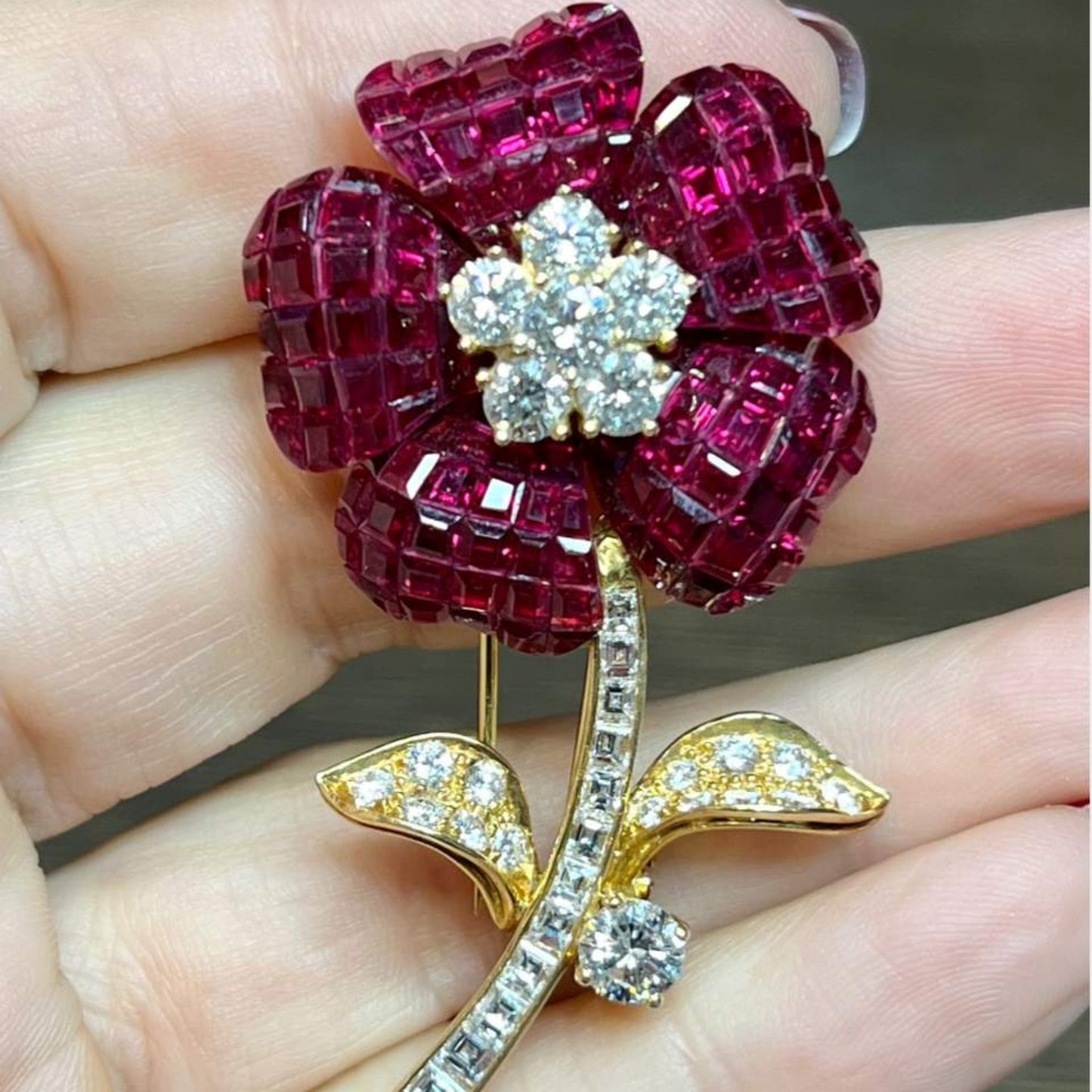 Post-1980s 18KT Yellow Gold Ruby & Diamond Flower Brooch in hand