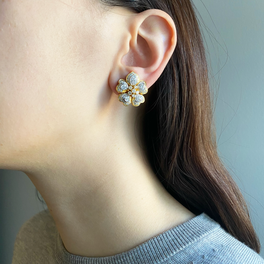 1980s 18KT Yellow Gold Diamond Flower Earrings worn on ear