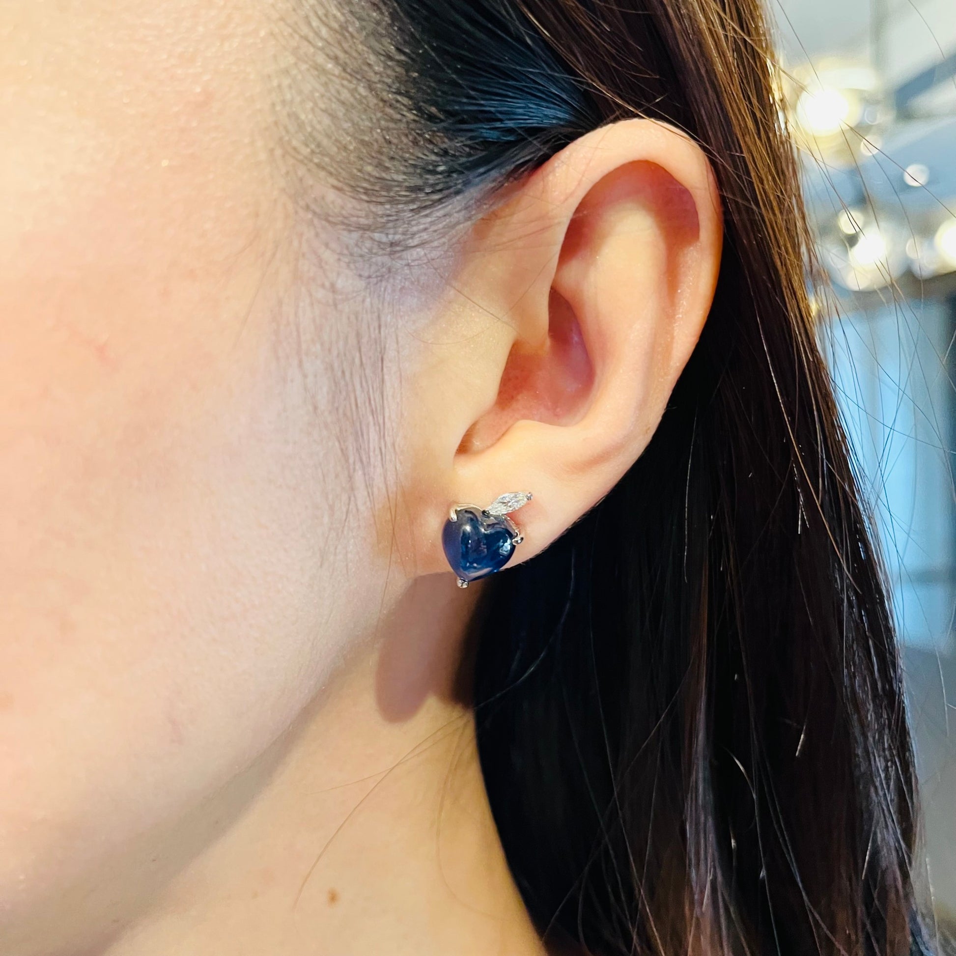 Contemporary 14KT White Gold Sapphire & Diamond Earrings on ear