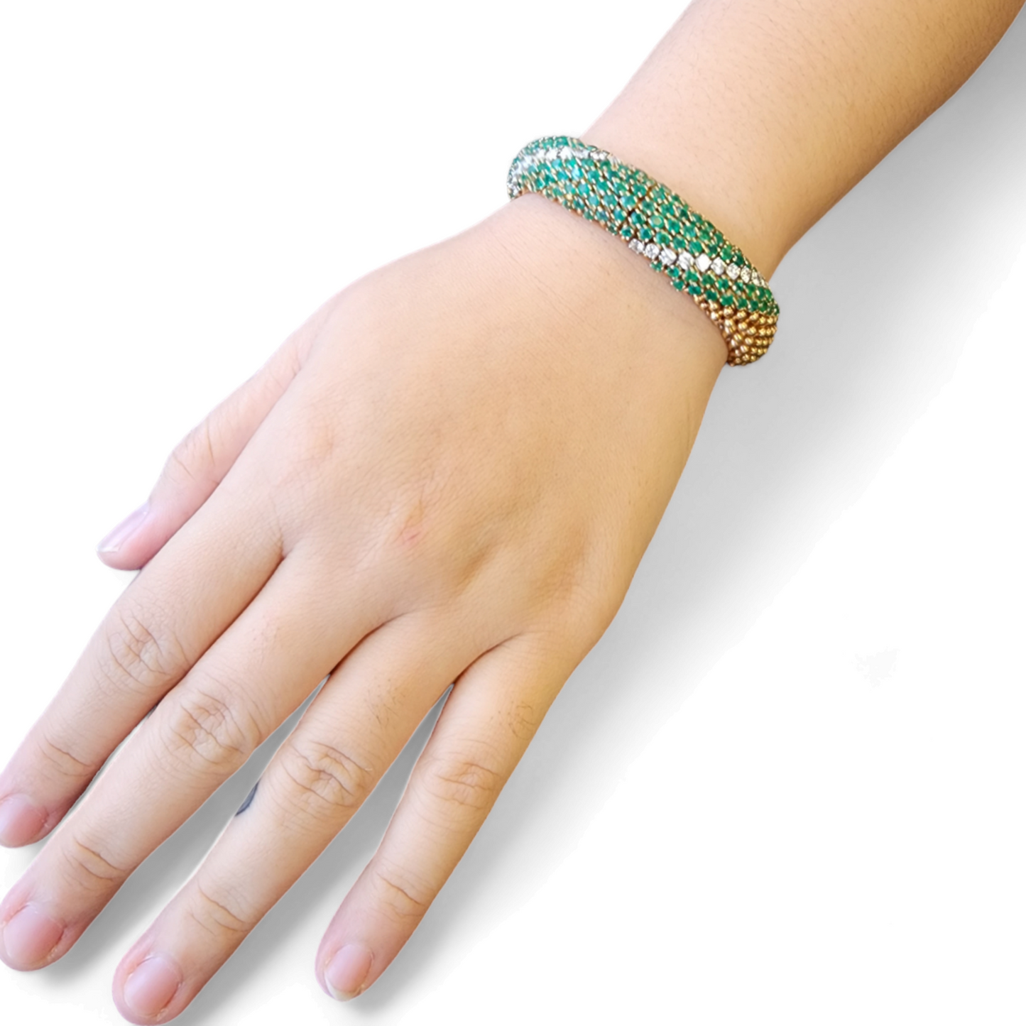 1960s 18KT Yellow Gold Emerald & Diamond Cous-Cous Bracelet on wrist