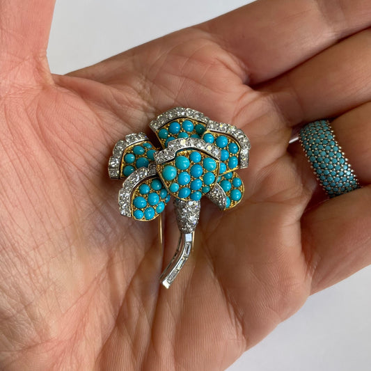 Cartier Paris 1930s 18KT Yellow Gold Turquoise & Diamond Flower Brooch in hand
