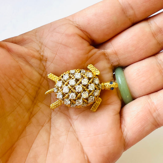 Cartier Paris 1960s Platinum & 18KT Yellow Gold Diamond & Sapphire Turtle Brooch in hand