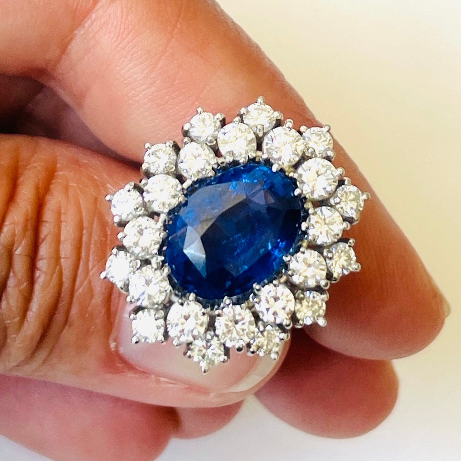 1980s 18KT White Gold Sapphire & Diamond Ring in hand