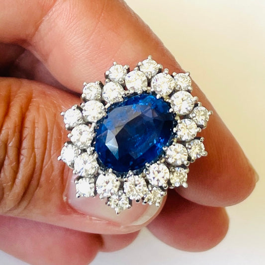 1980s 18KT White Gold Sapphire & Diamond Ring in hand