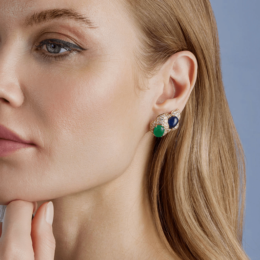 Bulgari 1980s 18KT Yellow Gold Emerald, Diamond, Sapphire Blue Earrings on ear