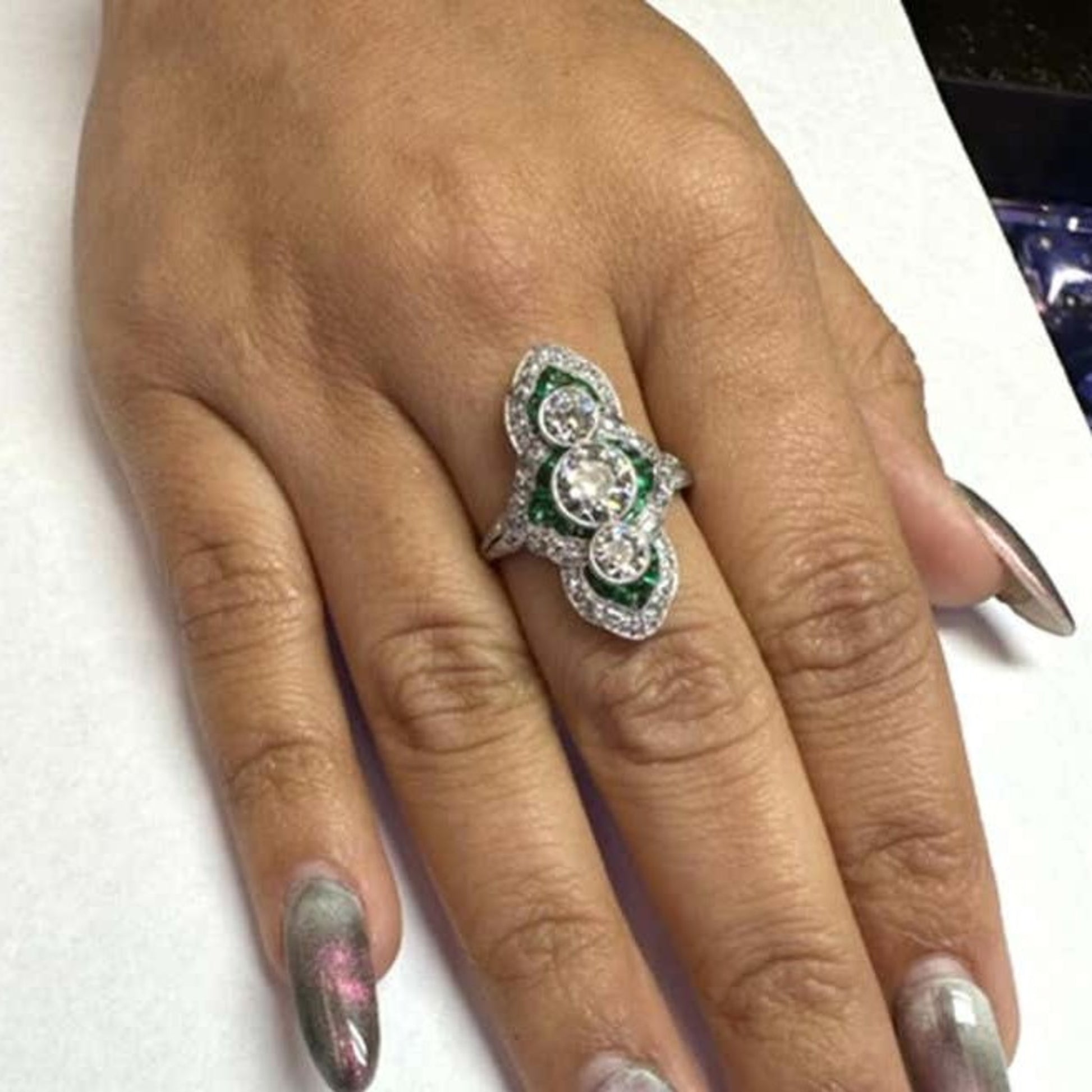 Art Deco Platinum Diamond & Emerald Ring on finger