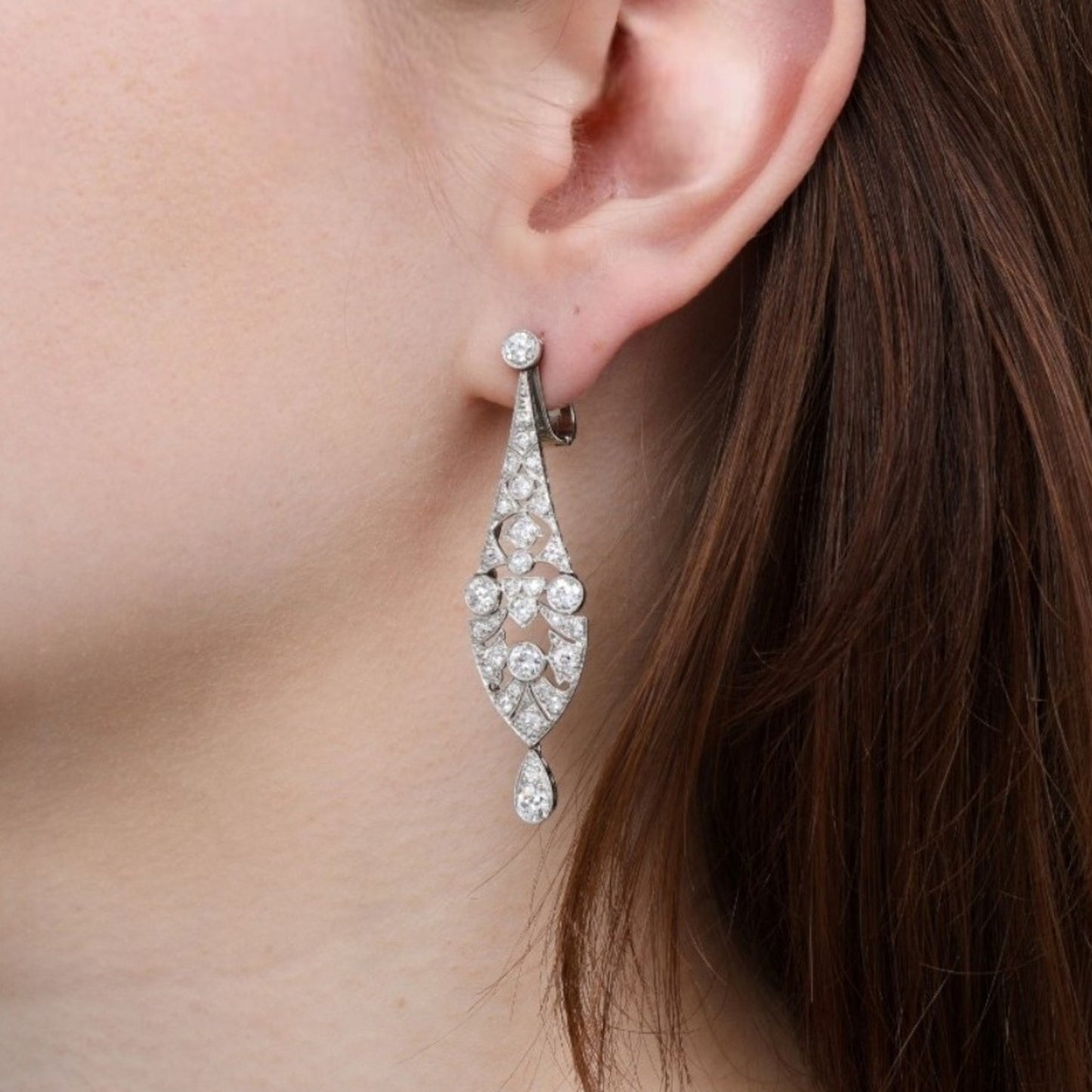 Art Deco Platinum & 18KT White Gold Diamond Earrings on ear