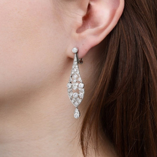 Art Deco Platinum & 18KT White Gold Diamond Earrings on ear