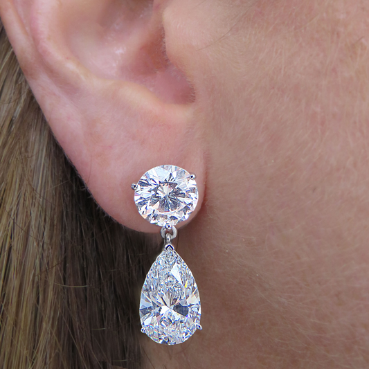 Contemporary Platinum Diamond Earrings on ear