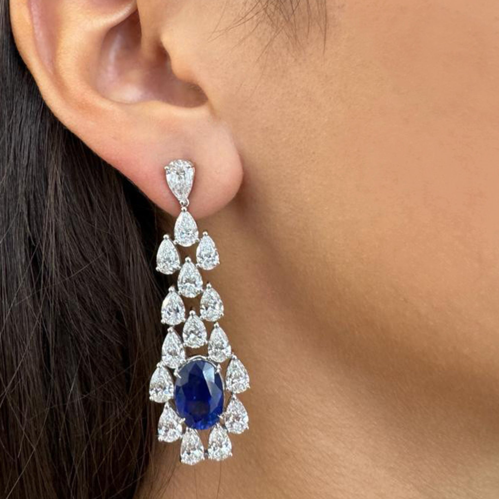 Contemporary 18KT White Gold Sapphire & Diamond Earrings on ear