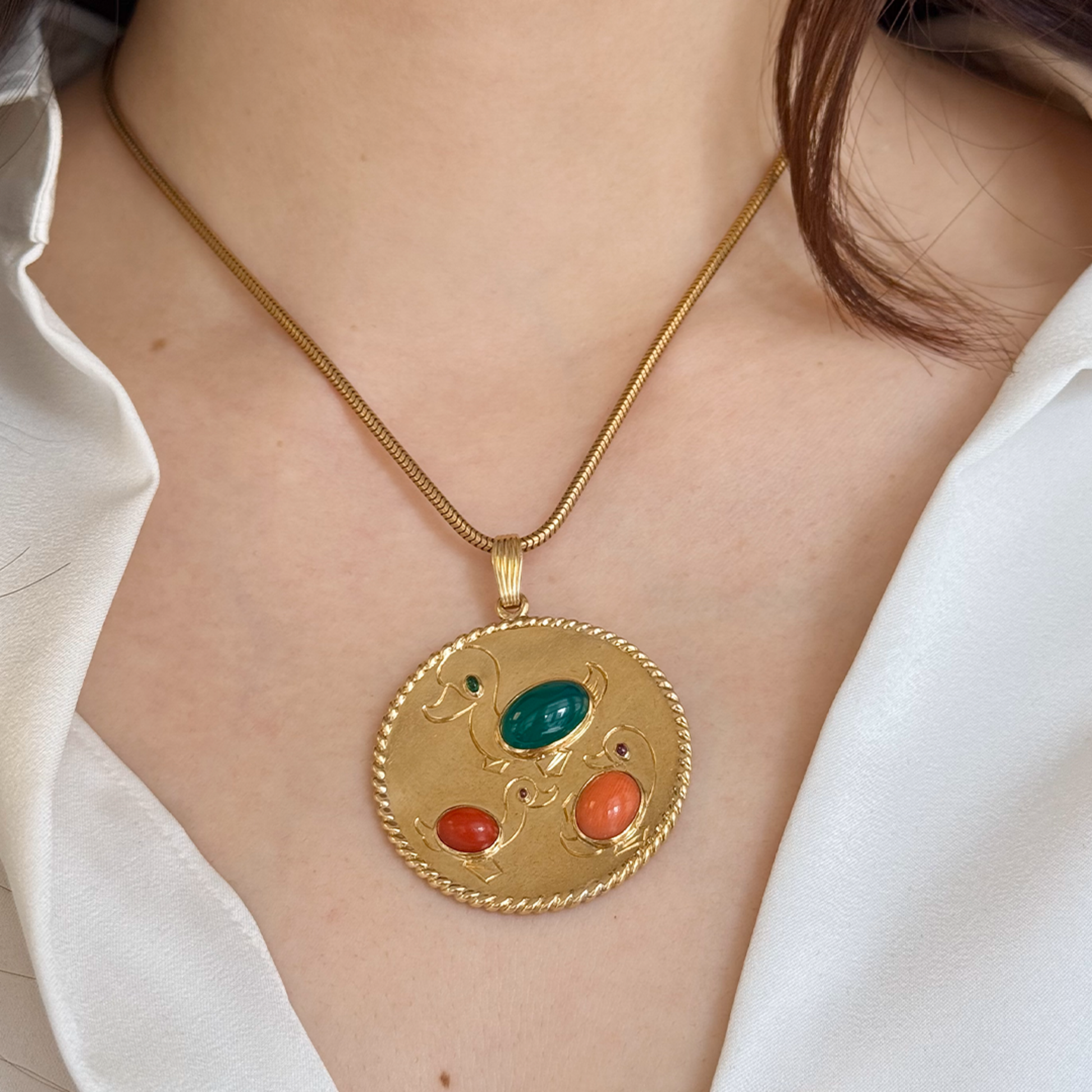 Cartier NY 1950s 18KT Yellow Gold Coral, Chrysoprase, Emerald & Ruby Duck Pendant on neck