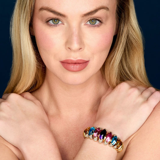 Bulgari Post-1980s 18KT Yellow Gold Multigem Celtaura Bracelet on wrist