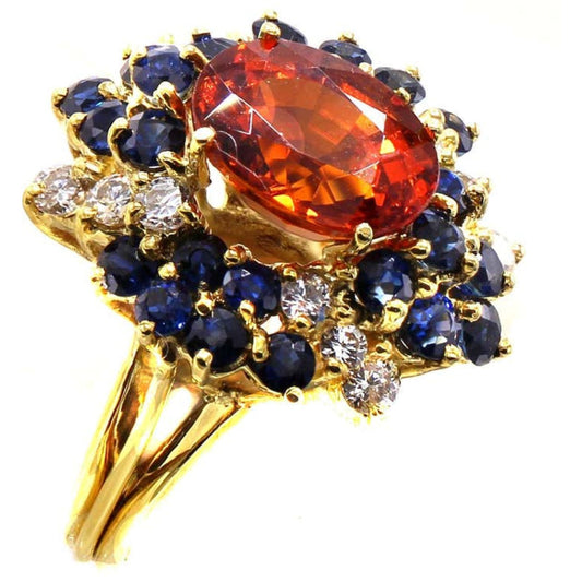1970s 18KT Yellow Gold Garnet, Diamond & Sapphire Ring side