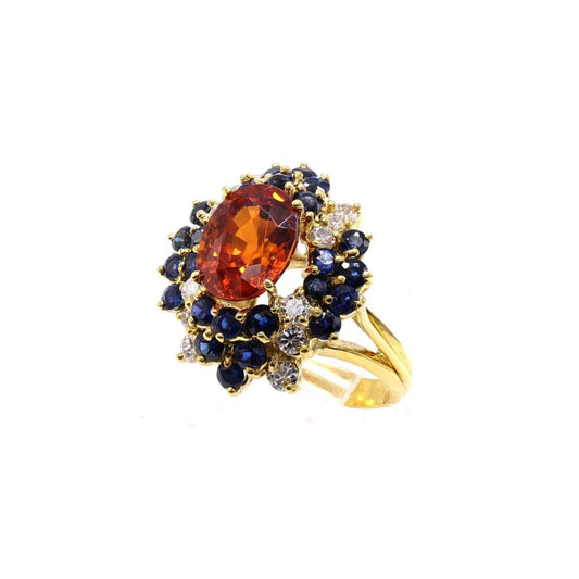 1970s 18KT Yellow Gold Garnet, Diamond & Sapphire Ring front
