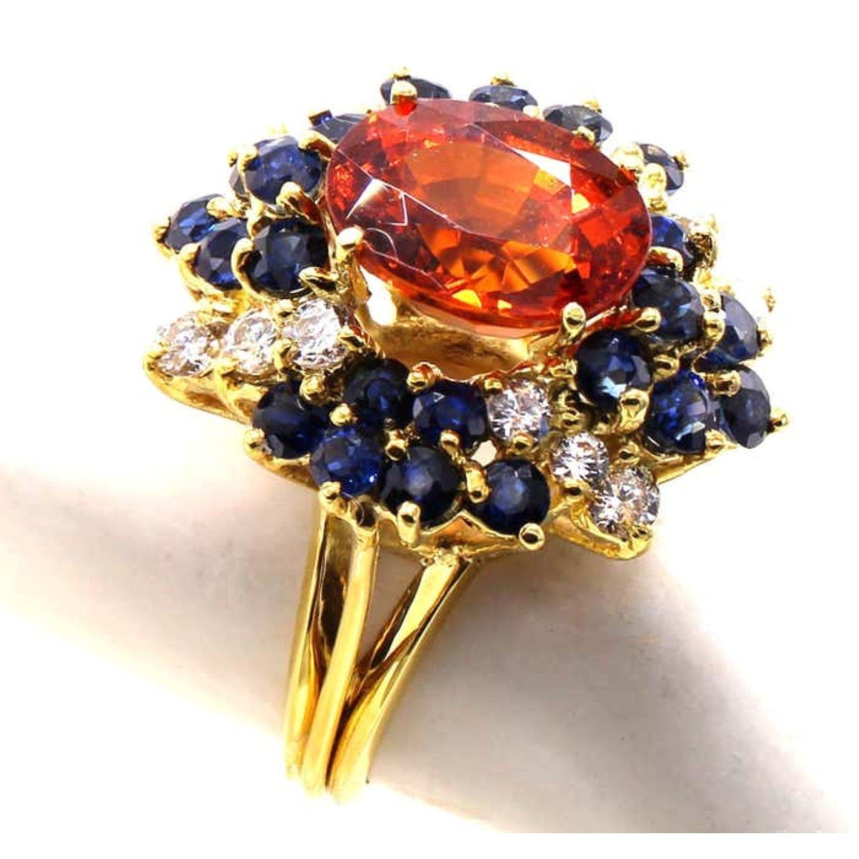 1970s 18KT Yellow Gold Garnet, Diamond & Sapphire Ring side