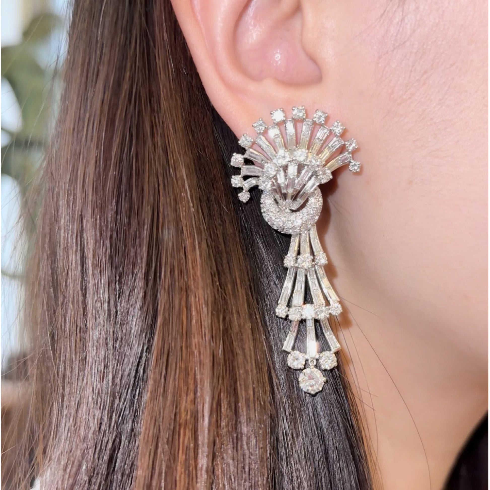 1960s Platinum Diamond Earrings on ear