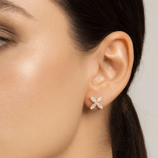 Contemporary 14KT Yellow Gold Diamond Earrings on ear