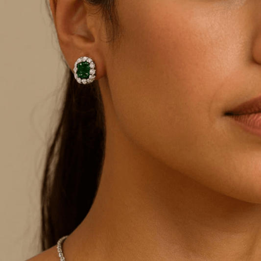 Post-1980s Platinum Emerald & Diamond Earrings on ear