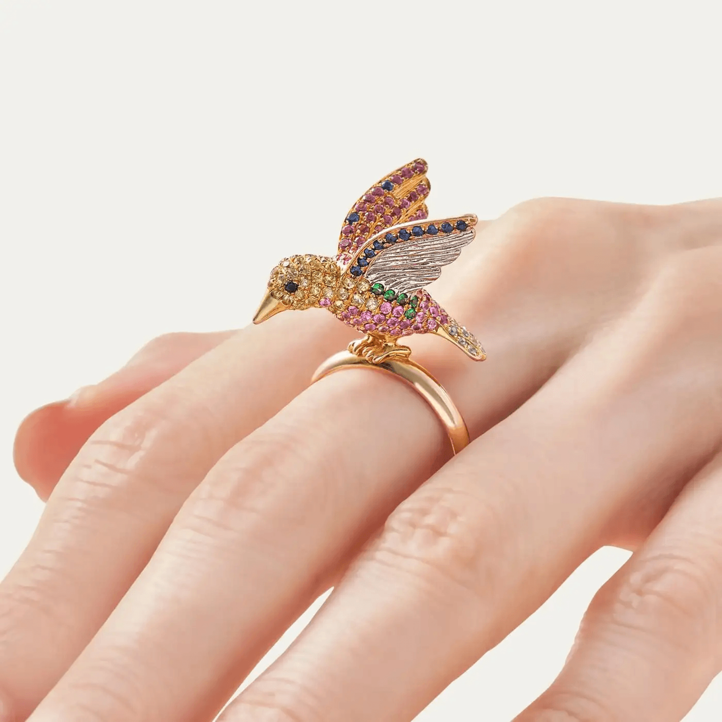 Mio Harutaka Post-1980s 18KT Yellow Gold Diamond, Garnet & Sapphire Bird Ring on finger