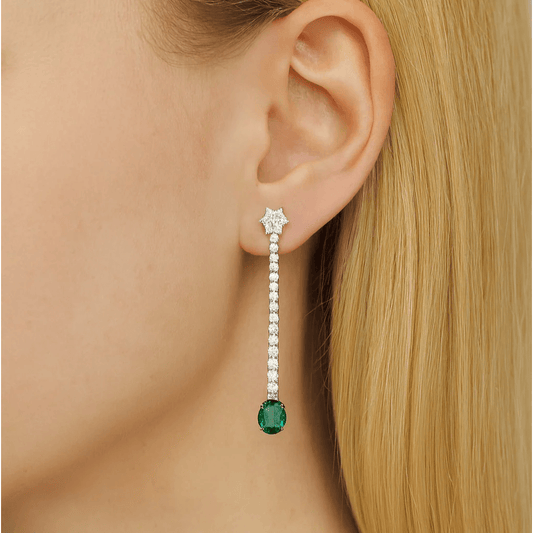 Contemporary 18KT White Gold Emerald & Diamond Earrings on ear