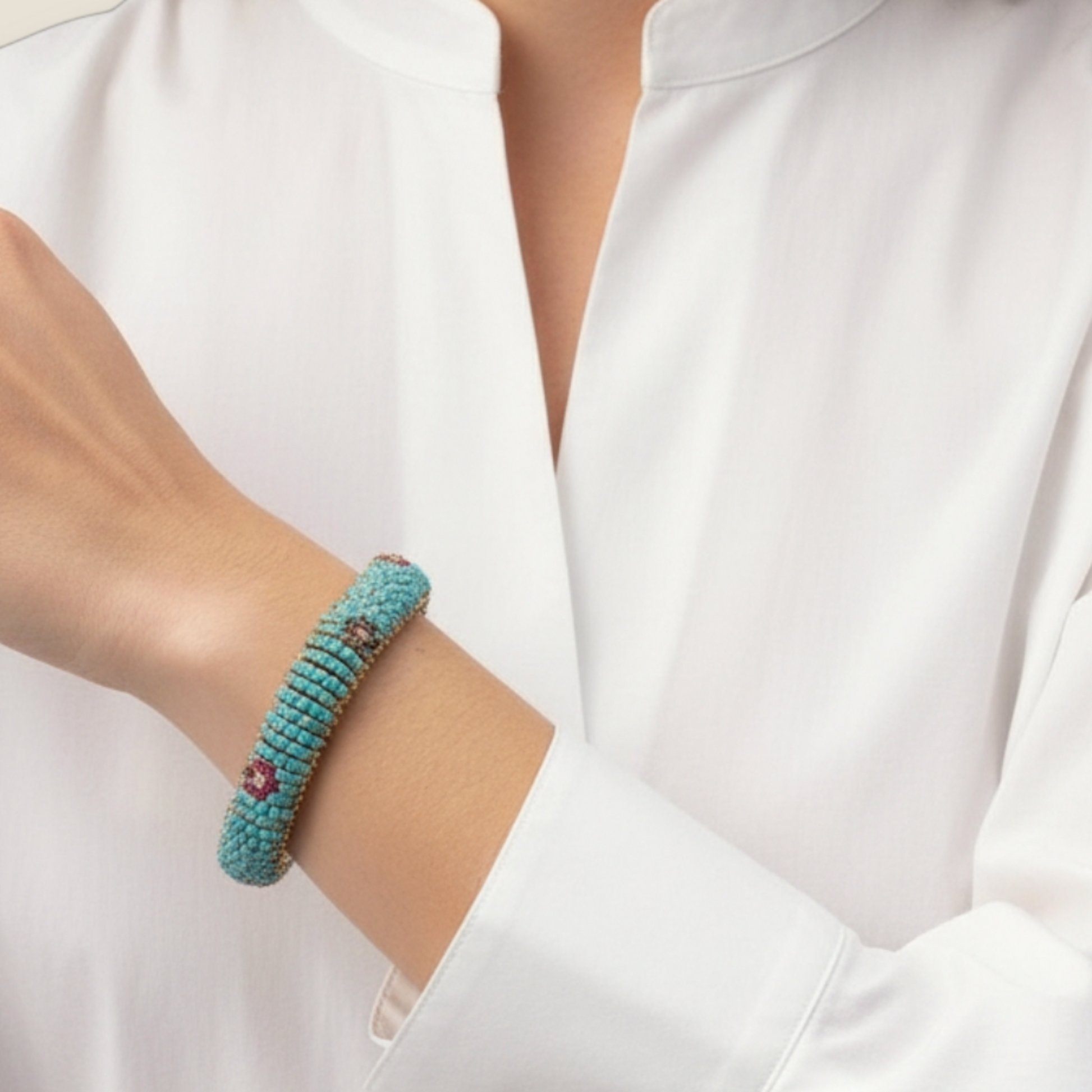 1960s 18KT Yellow Gold Turquoise, Diamond, Ruby & Sapphire Bracelet on wrist