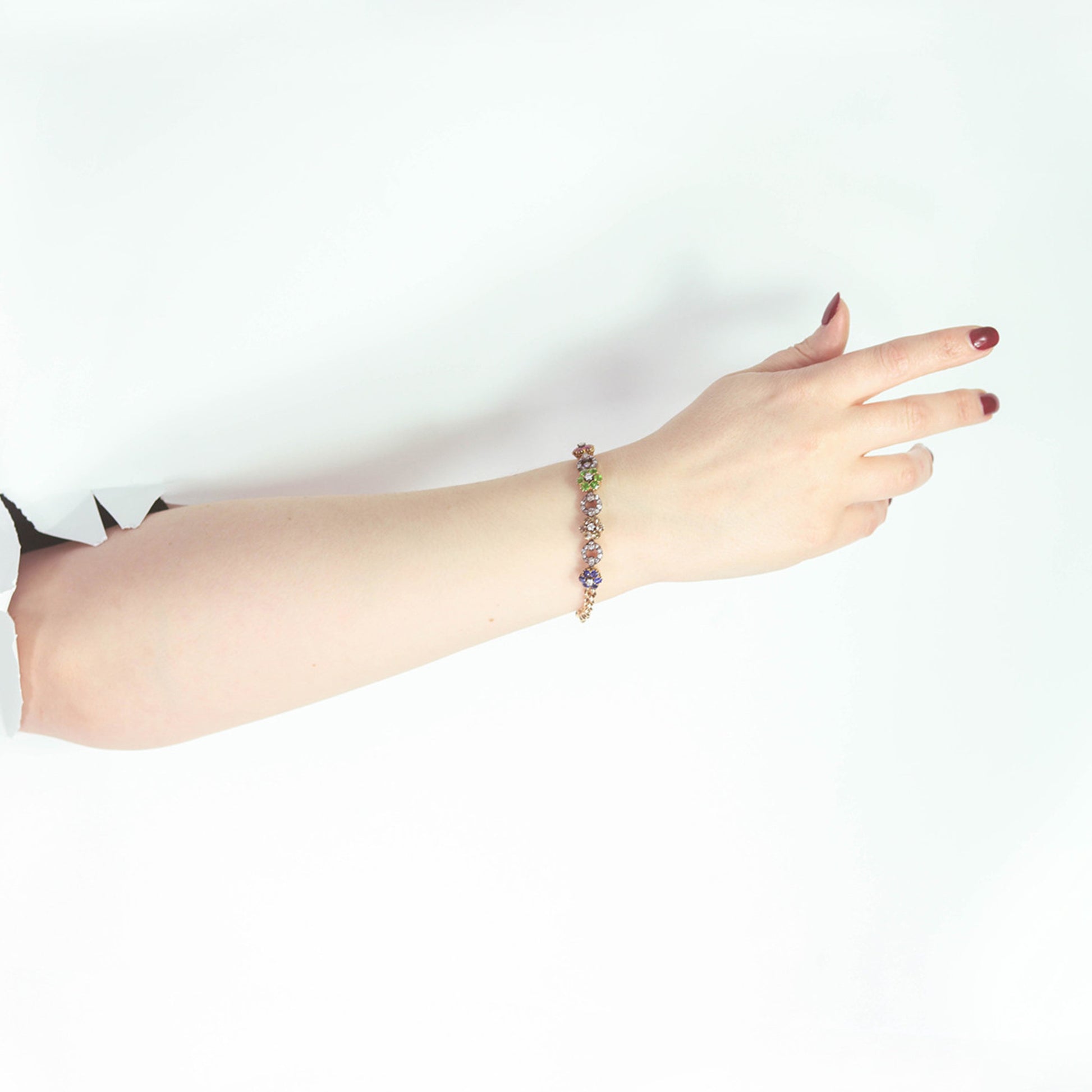 English Victorian Silver & 9KT Yellow Gold Diamond, Demantoid, Ruby & Sapphire Bracelet on wrist