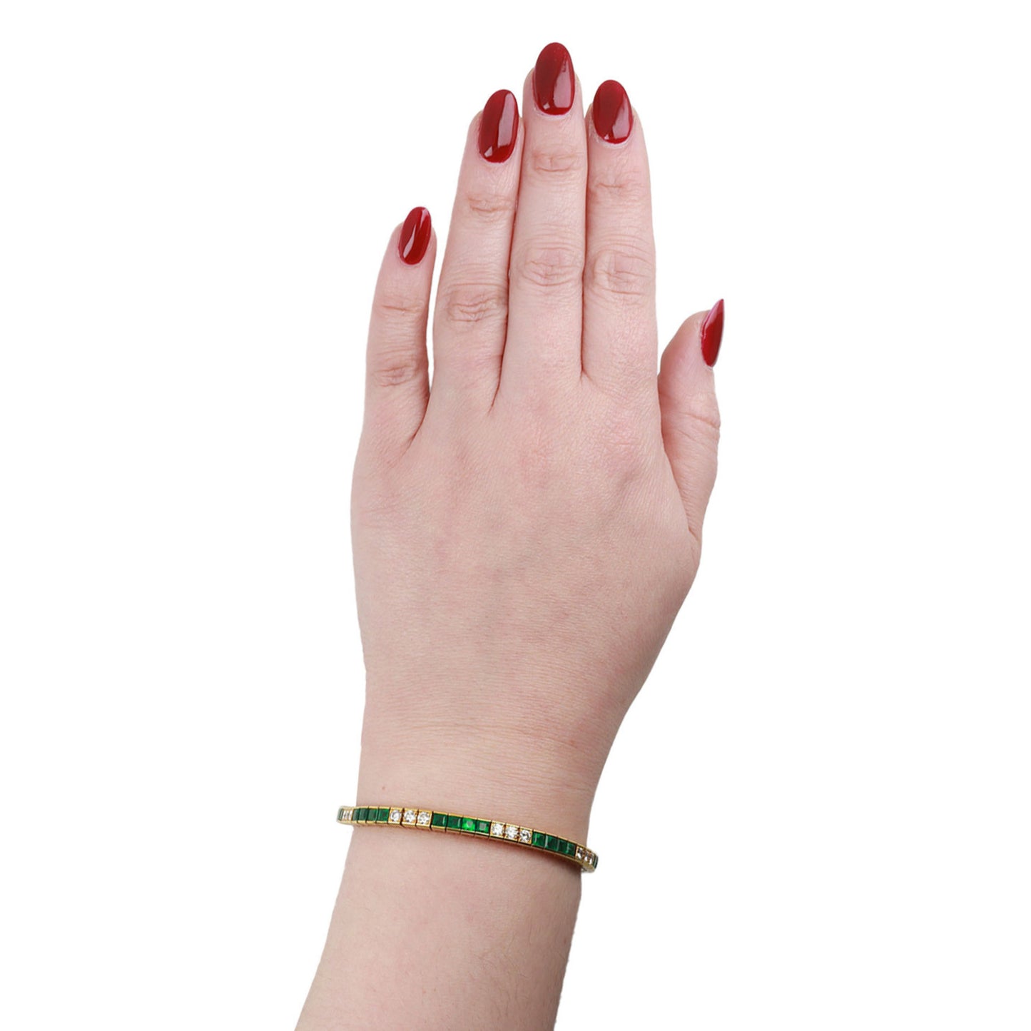 Tiffany & Co. 1980s 18KT Yellow Gold Emerald & Diamond Bracelet on wrist