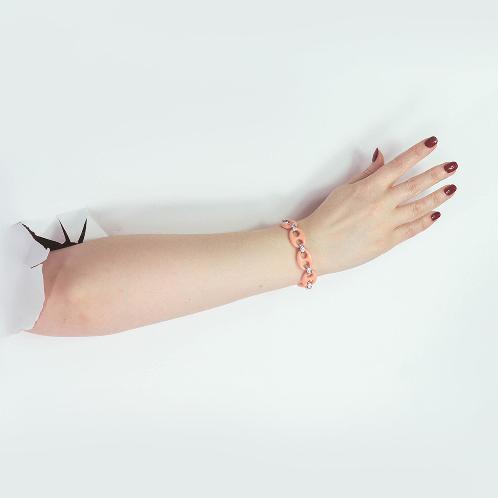 Italian 1970s 18KT White Gold Coral & Diamond Bracelet on wrist