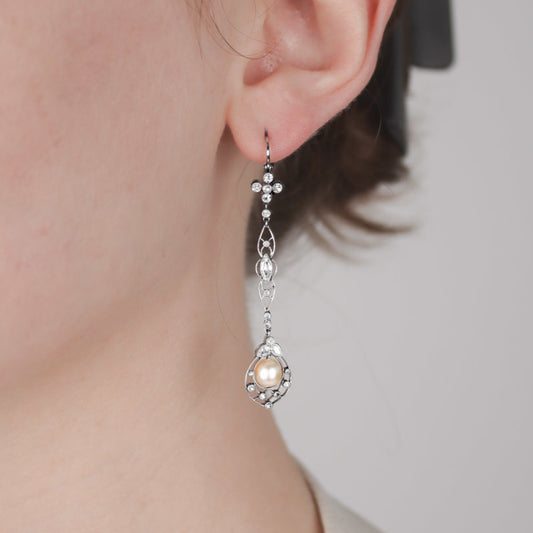 Edwardian Platinum Natural Pearl & Diamond Earrings on ear