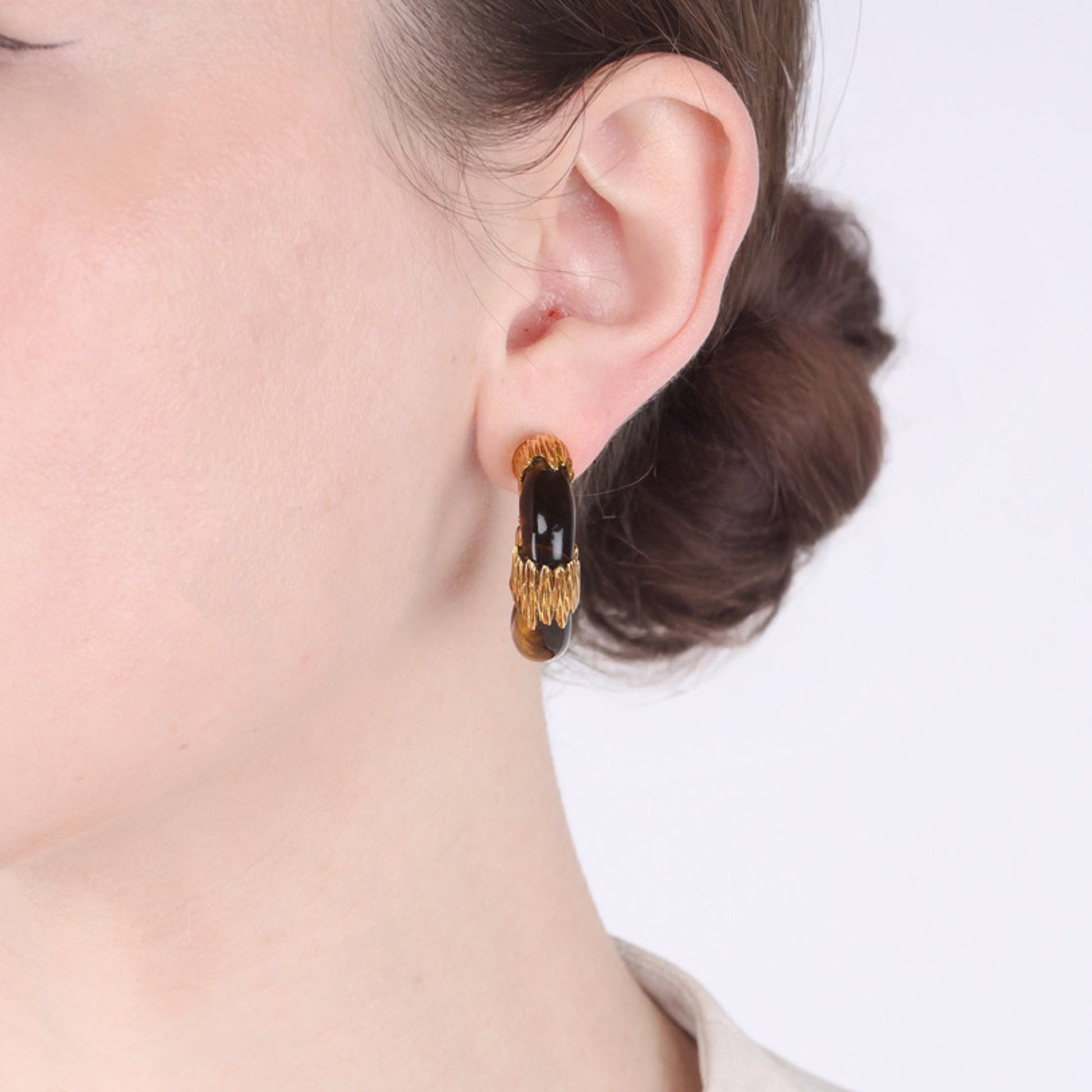 Kutchinsky English 1970s 18KT Yellow Gold Tiger's Eye Earrings on ear