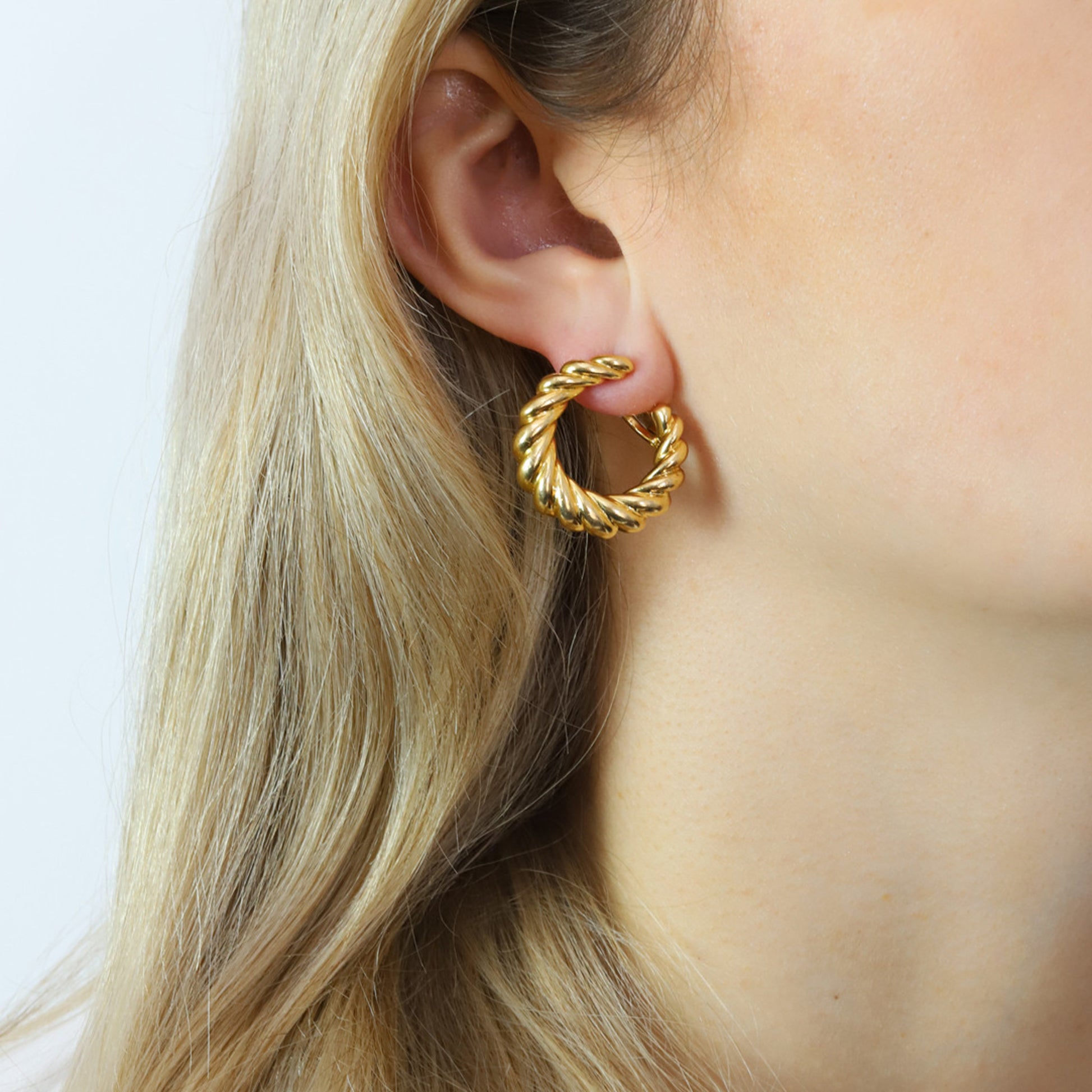 Cartier French 1980s 18KT Yellow Gold Earrings on ear