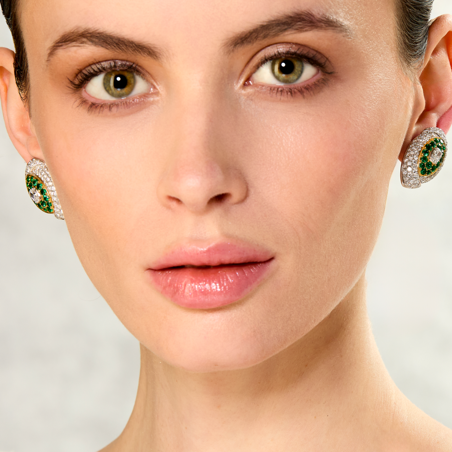 Fred Paris 1970s 18KT Yellow Gold Emerald & Diamond Earrings on ear